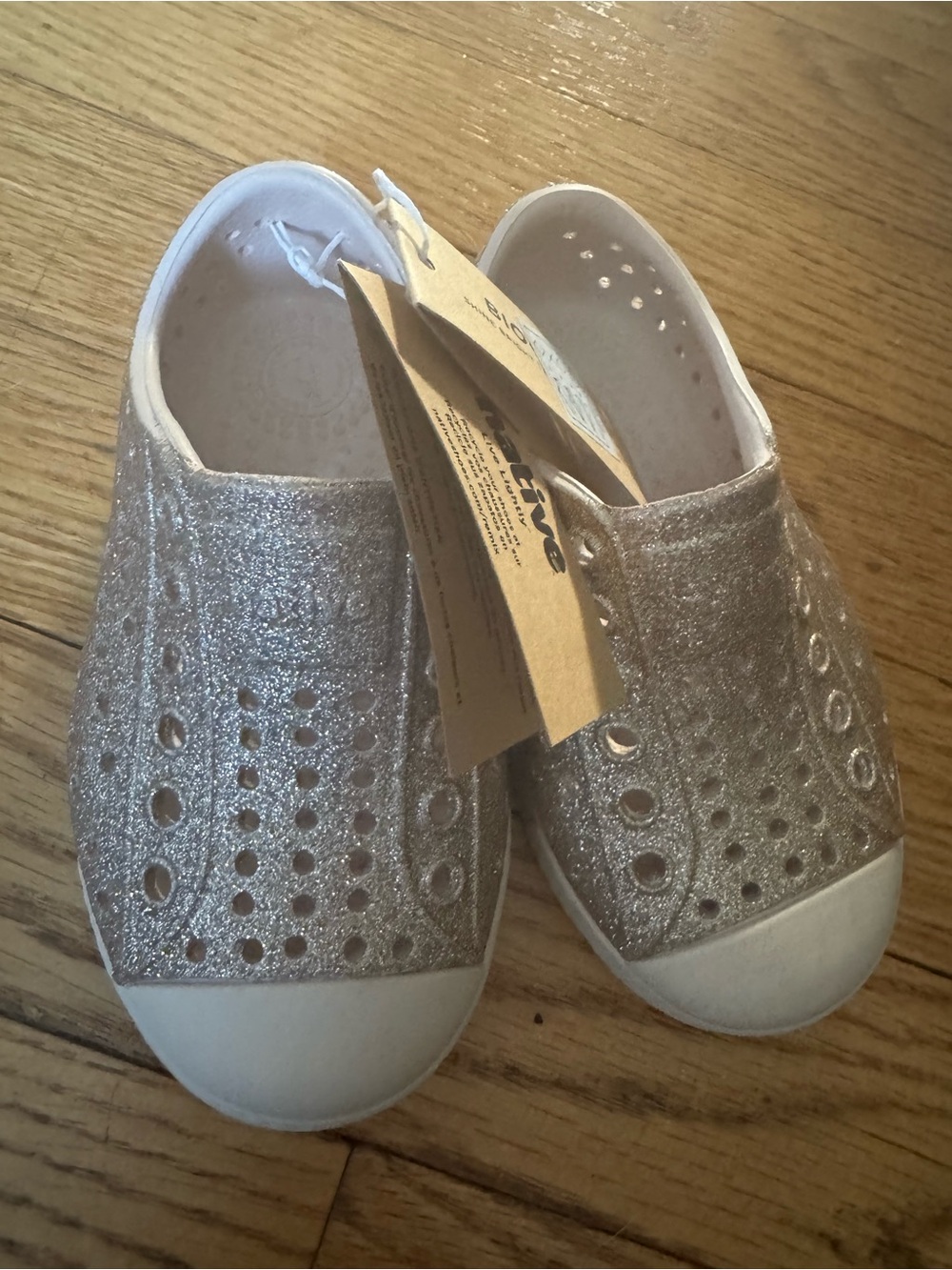 NWT glitter gold natives size C6